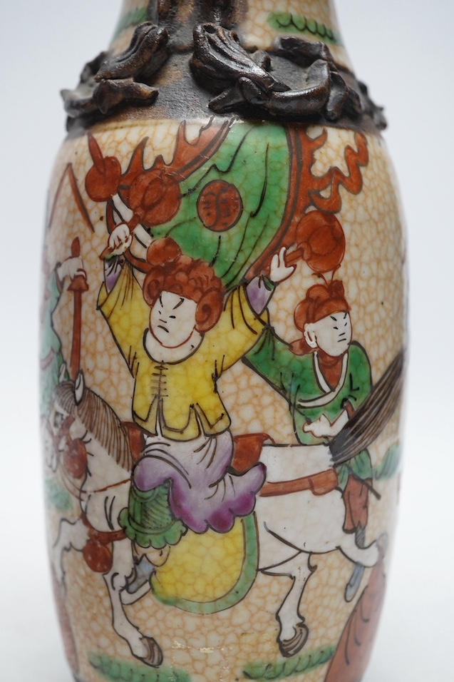 A 19th century Chinese crackle glazed vase and a ruby ground vase, tallest 25cm. Condition - crackle glazed vase with repair to rim, otherwise good